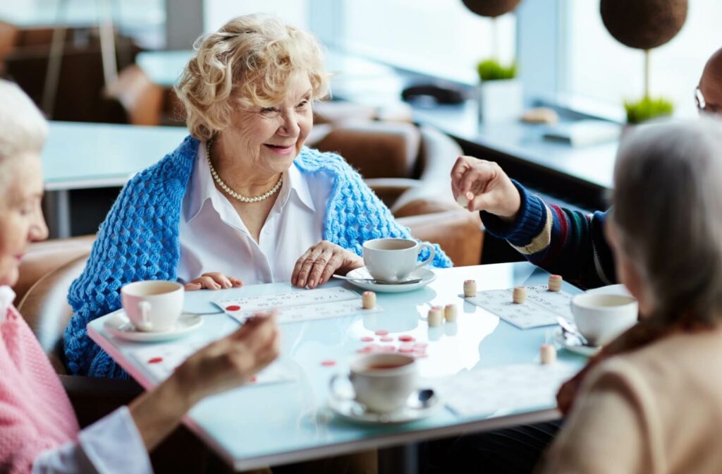 a group of seniors in memory care play bingo