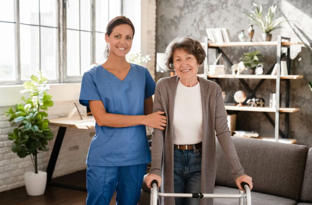 A senior woman smiling with her caregiver.